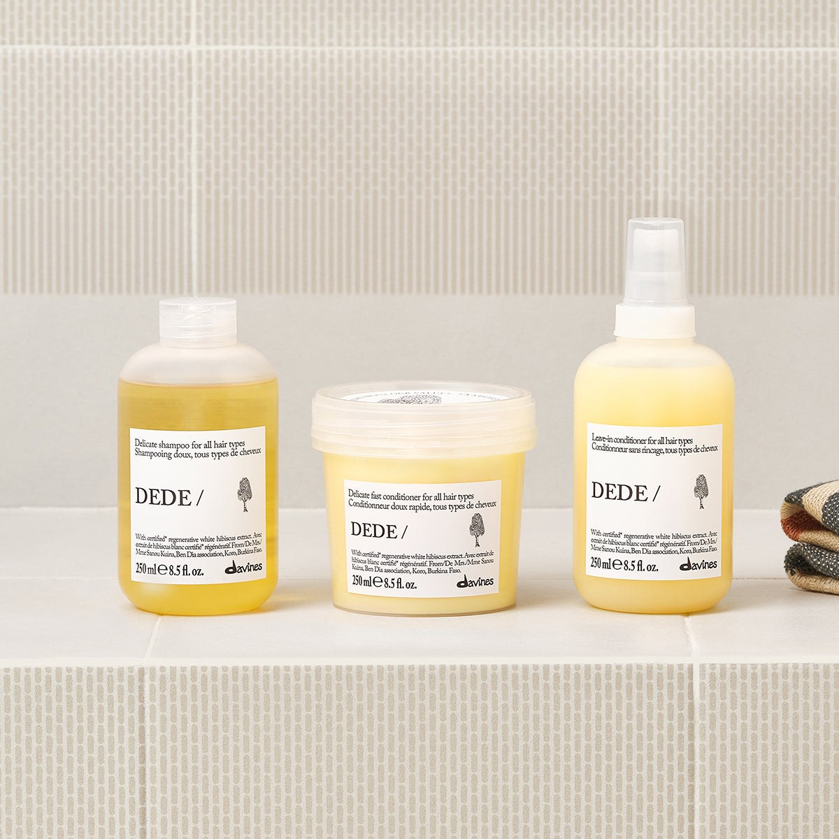 Davines DEDE Shampoo with the DEDE range on a bathroom shelf
