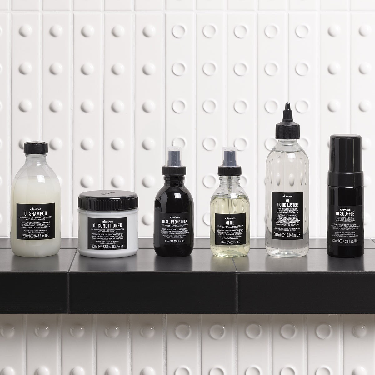 Davines OI Conditioner with the OI range on a bathroom shelf